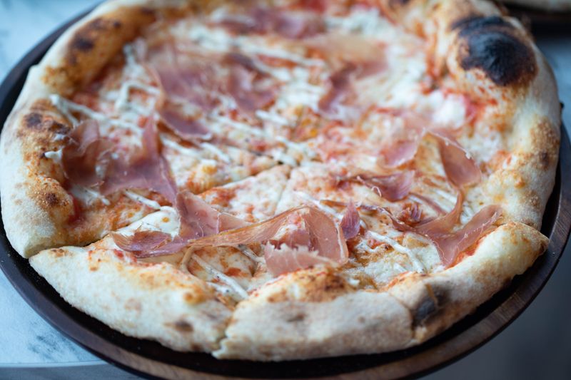 White truffle thin crust gourmet pizza
